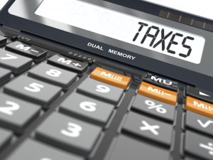 taxes spelled out on a calculator